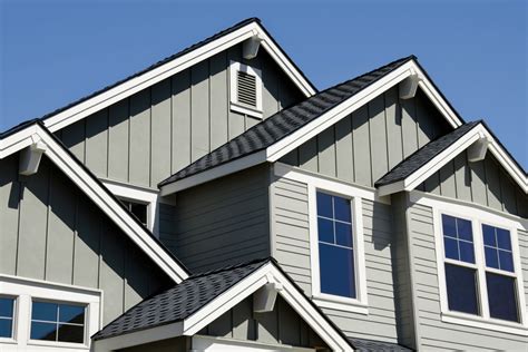 grey house exterior paint with metal roof wood posts|gray roof exterior colors.